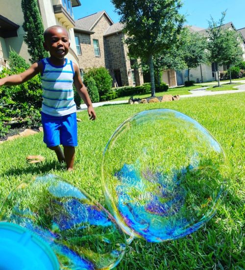 little boy with bubbles, good in a hard situation